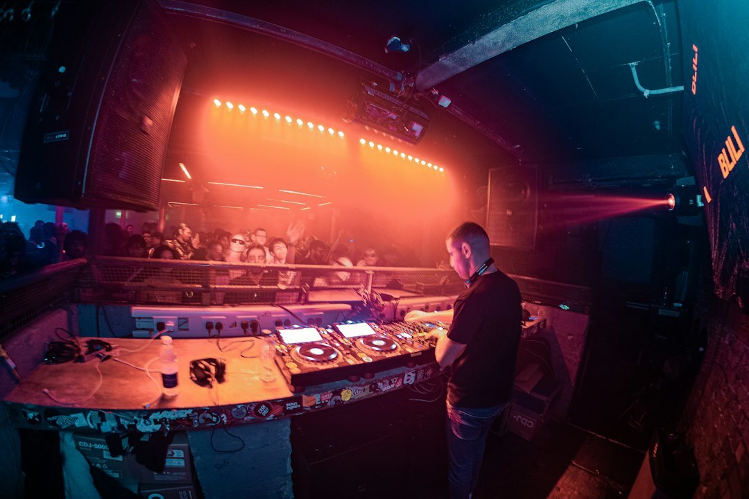 Vision mixing desk with multiple camera preview screens during a live broadcast